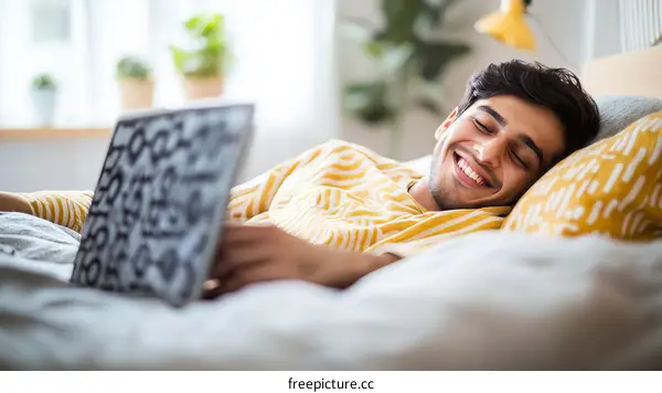 Man Relaxing on Bed with Tablet