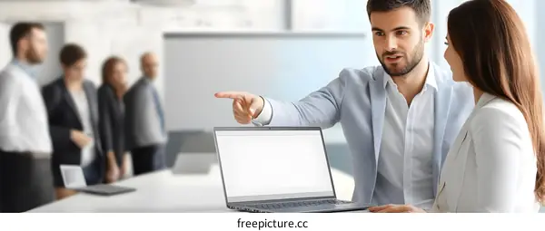 Business Meeting Presentation with Laptop and Whiteboard