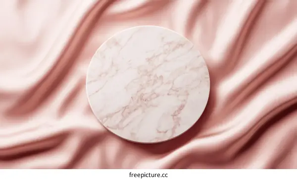 Elegant Marble Circle on a Soft Pink Satin
