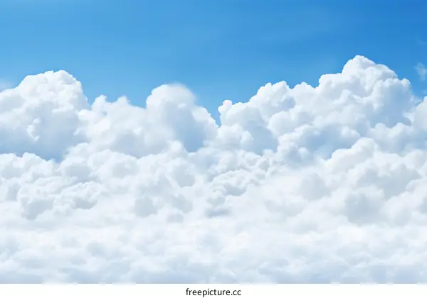 Beautiful Blue Sky with Fluffy Clouds Background