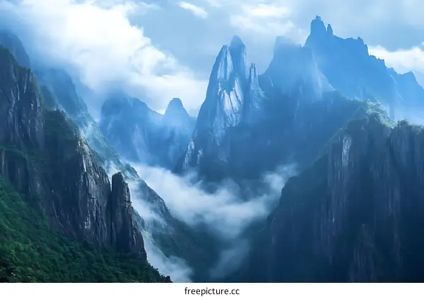 Mountain Range with Clouds and Fog