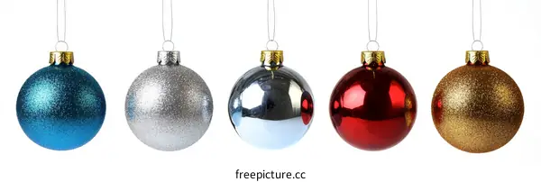Four Colorful Christmas Ornaments on White Background