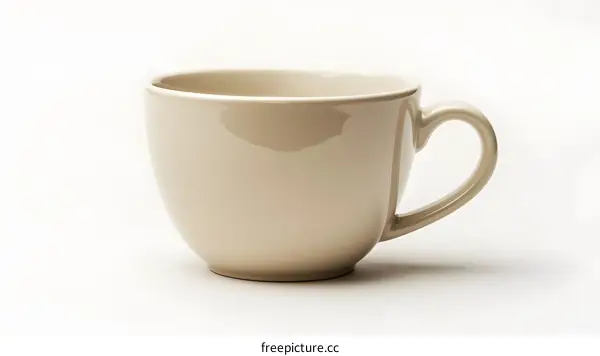 Beige ceramic mug on white background