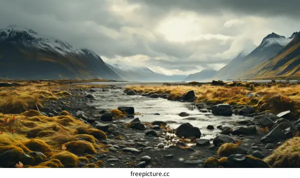 stones in river with mountain and clouds in background