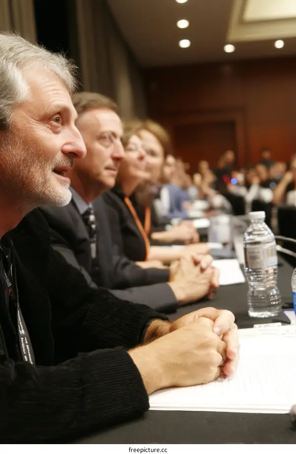 Business Conference Attendees Listening Attentively