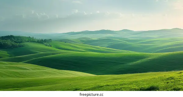Picturesque green hills landscape under cloudy sky