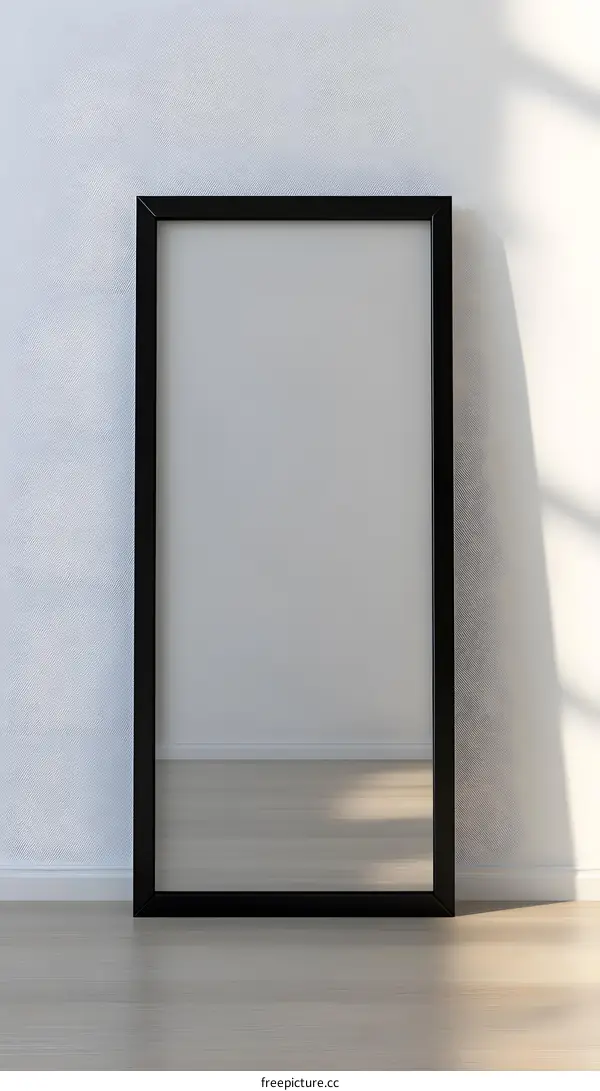 Black Frame Mirror on White Wall with Sunlight