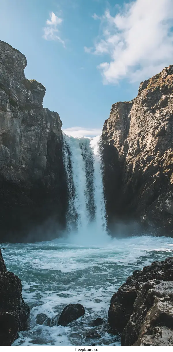 Waterfall Flowing Between Cliffs With Blue Sky