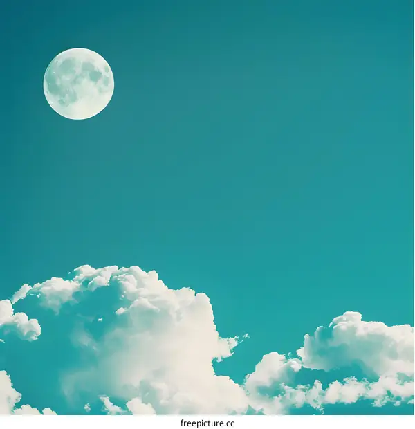 White Clouds And Full Moon In Blue Sky