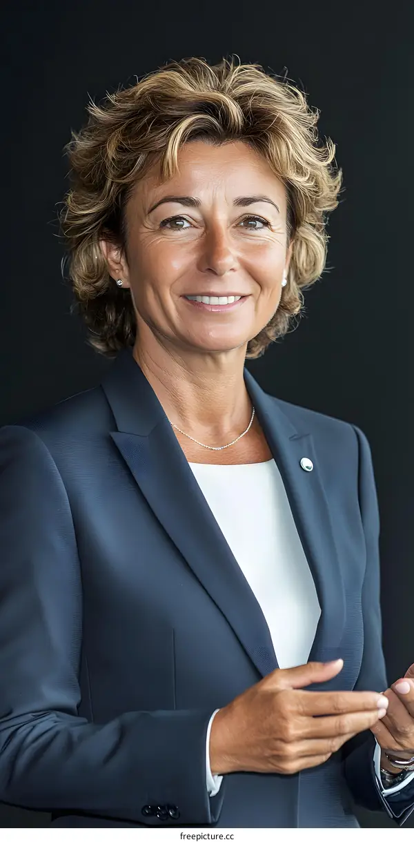Portrait of a Smiling Woman in a Business Suit
