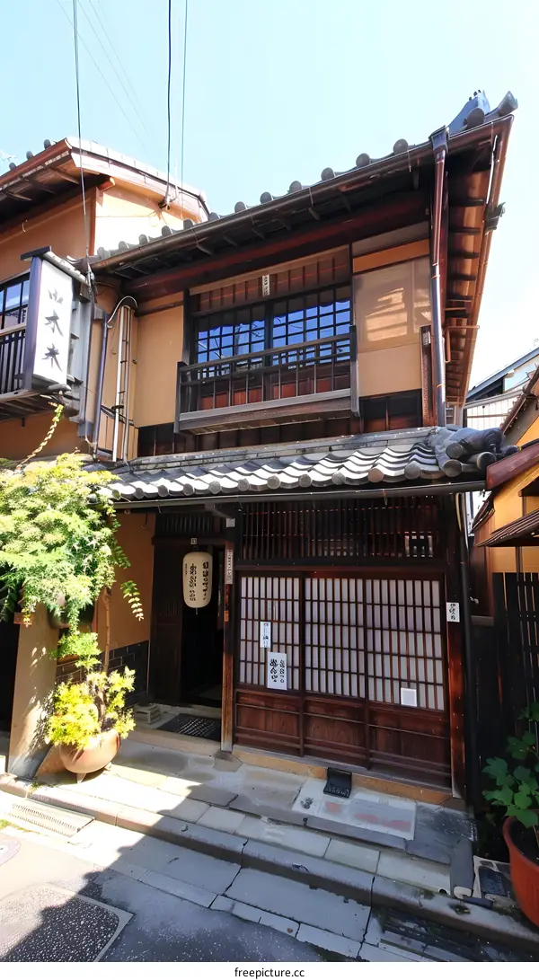A traditional Japanese house with a wooden facade and lattice windows.