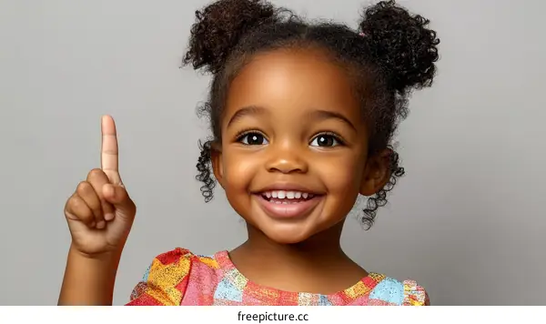 A Smiling Child Pointing with Joyful Expression