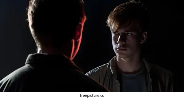 Two Men Confronting Each Other in the Dark