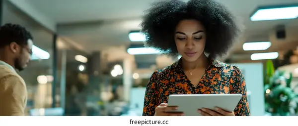 African American Businesswoman Using Tablet in Office