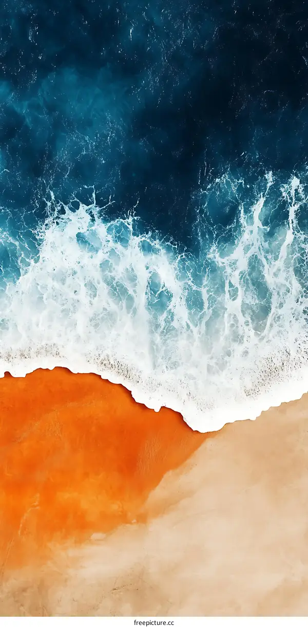 Aerial View of Ocean Waves Crashing on Sandy Beach