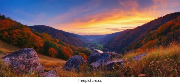 Autumn Sunset Over Mountain Valley Landscape