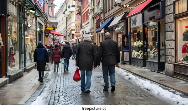 Snowy Street with People Walking in Europe