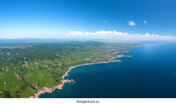 Coastal Landscape Aerial View of Lush Green Mountains and Water
