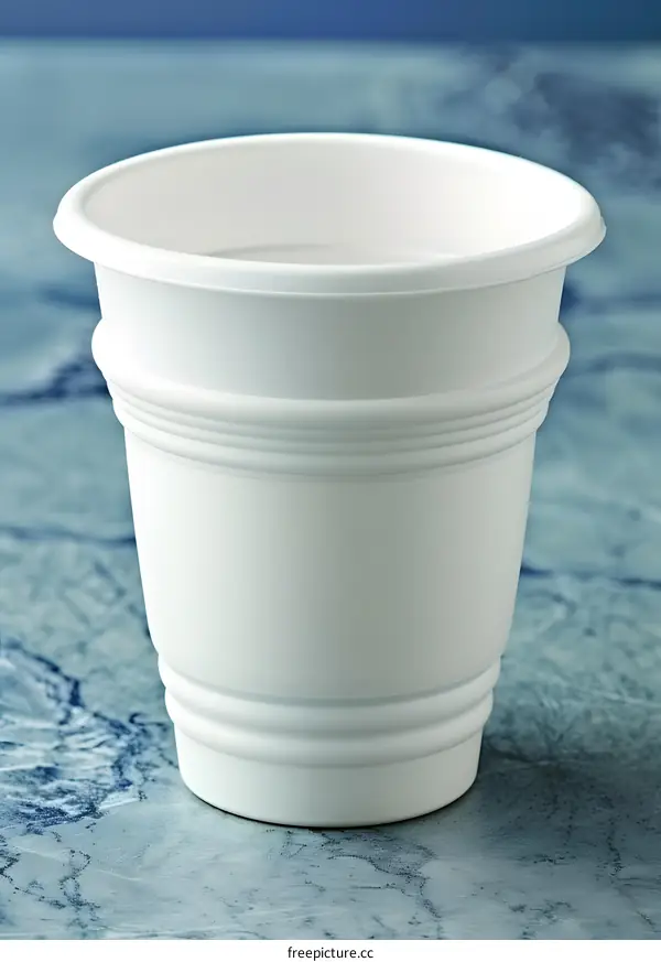 White Plastic Flower Pot on Blue Marble Background