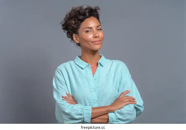 Confident Woman in Light Teal Shirt