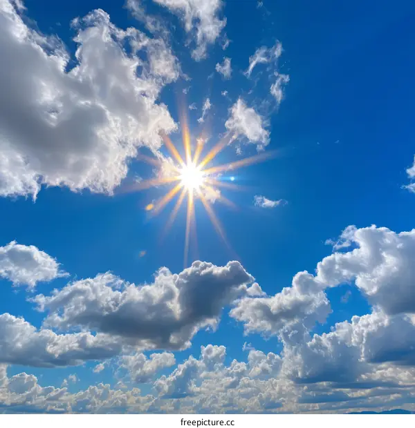 Sunbeams Through White Clouds in a Blue Sky