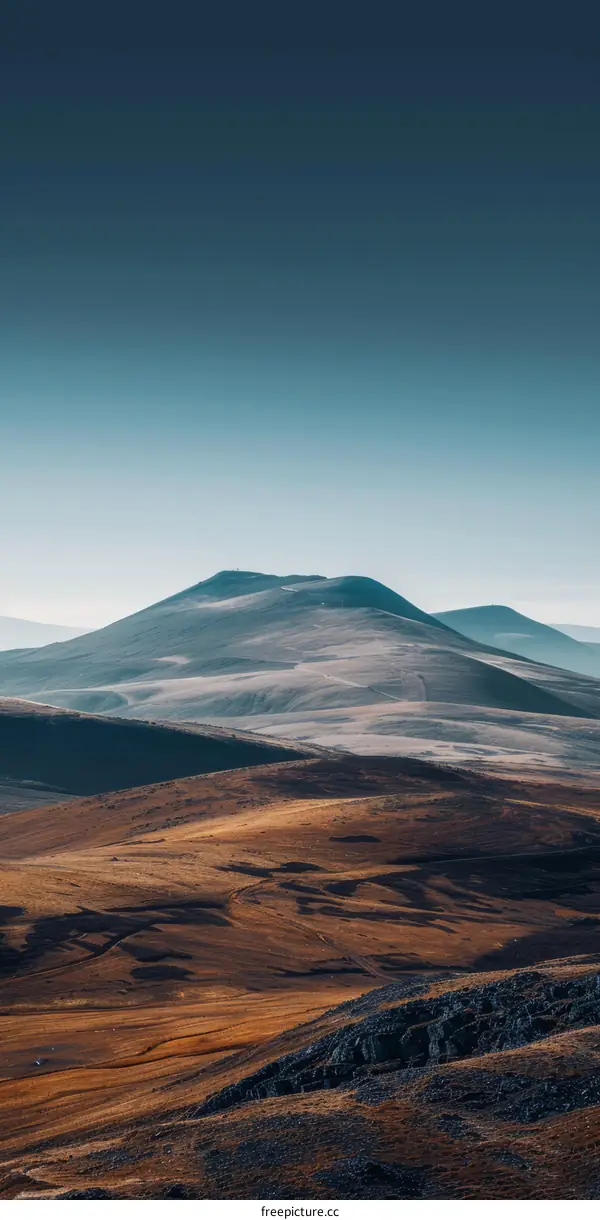 Layered Mountain Topography with Azure Sky