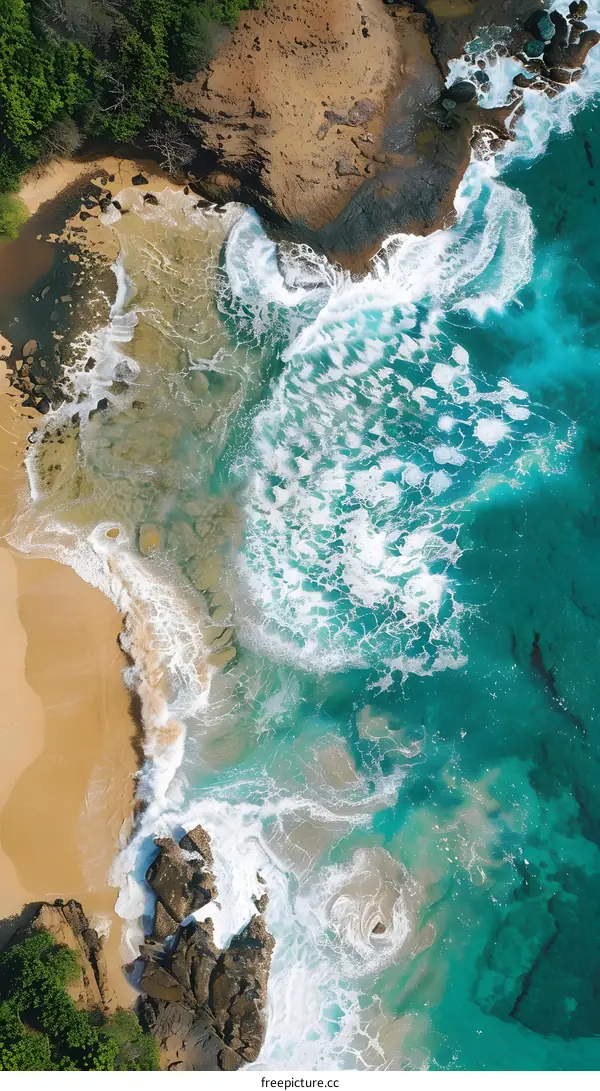 Aerial View of Ocean Waves Crashing on Shore