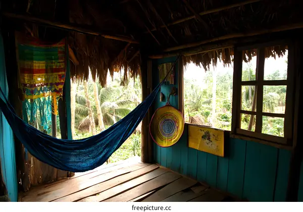 Hammock Hanging in Tropical Hut with Wooden Floor