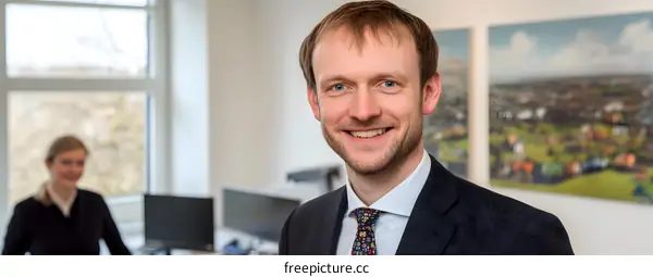 Portrait of a Smiling Man in a Business Suit