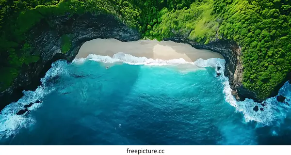 Aerial View of Secluded Beach with Lush Green Cliffs