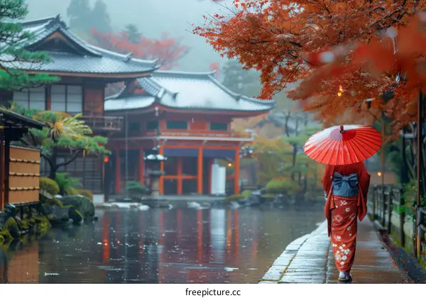 A woman in a kimono walking in a traditional Japanese garden