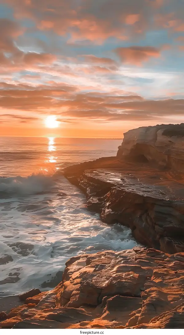 Sunset Over Rocky Ocean Coastline