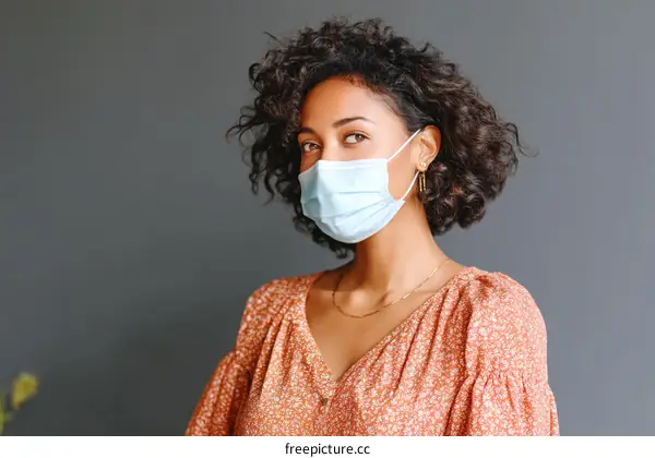Woman Wearing a Protective Mask in a Studio Setting