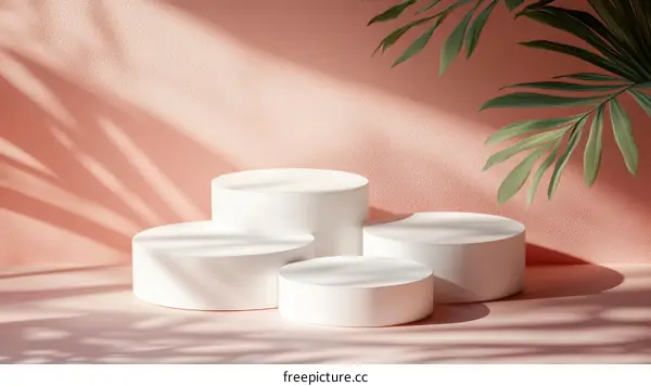 White Cylindrical Podiums Against a Pastel Background