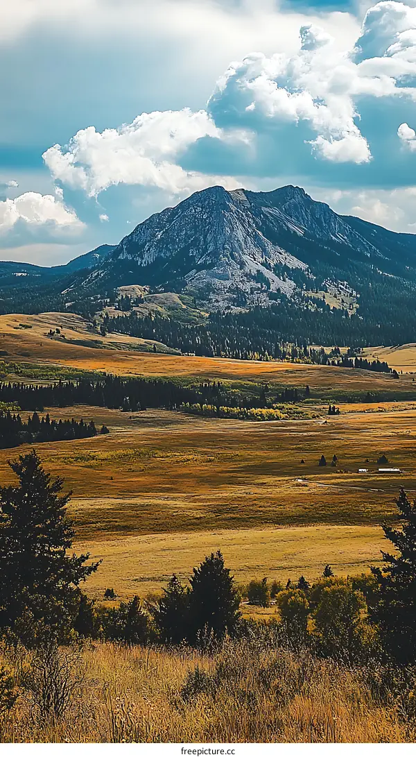 Mountain Range With Rolling Hills and Cloudy Sky