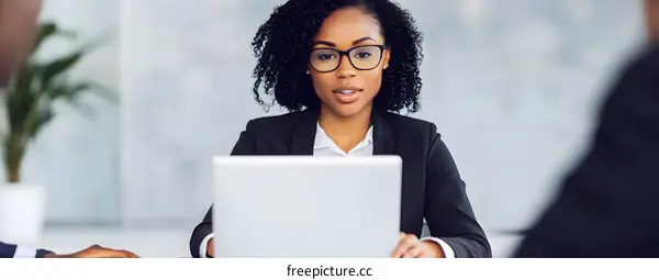 Professional African American Businesswoman Using Laptop