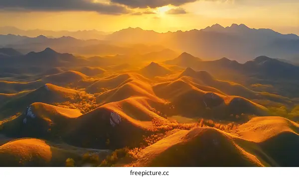 Golden Hills Under a Dramatic Sunset