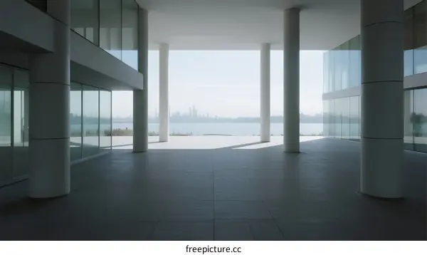 Modern Building Interior with Large Glass Windows Overlooking Water View