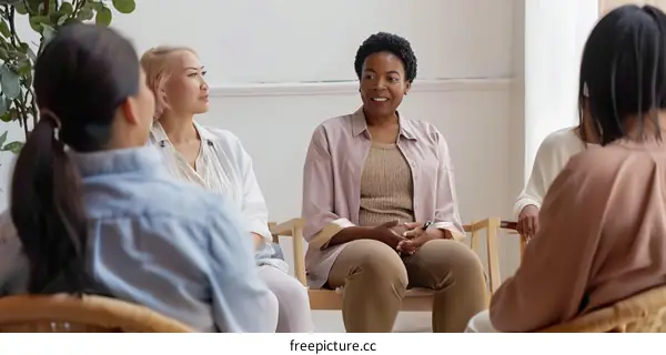 A group of diverse women sitting in a circle talking