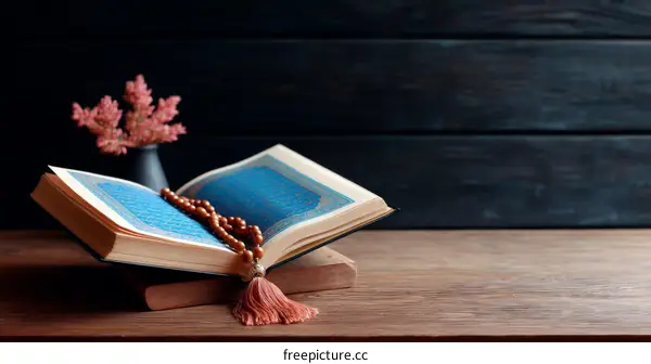 Holy Book Open on Wooden Table with Tasbih